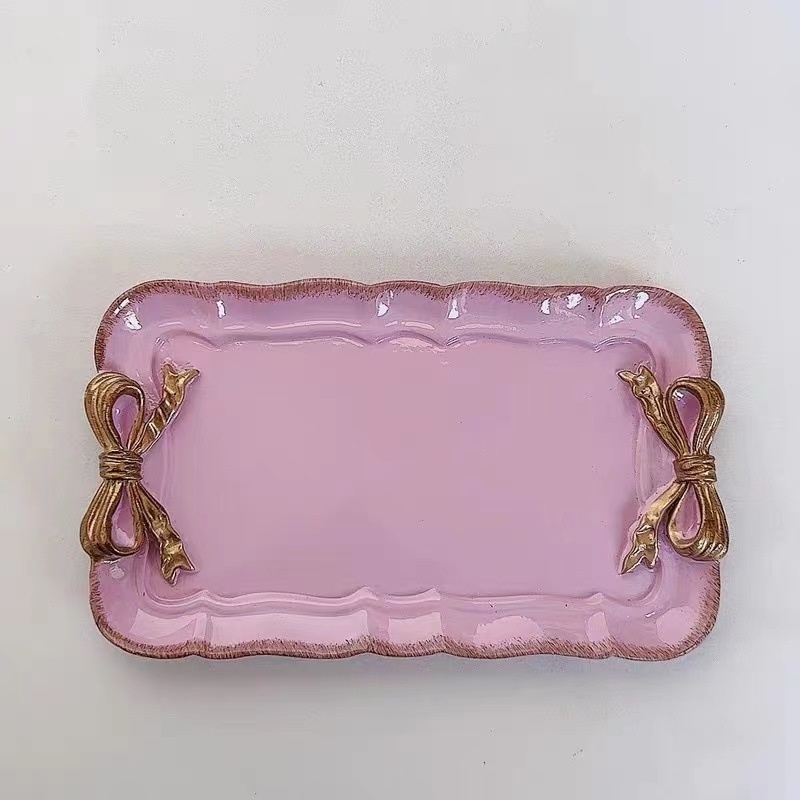 2fa65748-7204-4766-9560-f8194f1ceea8_trans.jpeg Creative Resin French Romantic Gold-plated Bow Jewelry Tray