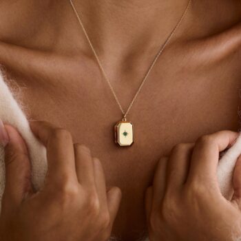 A Pendant Necklace With Birthstones Embedded In It - View 1